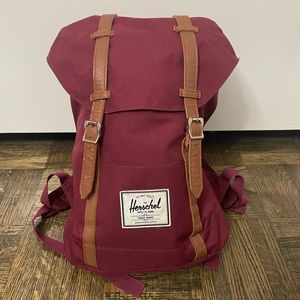 Red or maroon Herschel backpack